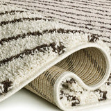 Alfombra shaggy ondas Lush Coastalina Blanco Atticgo Doblada